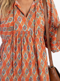 Tabitha – Geometric Print V-Neck Tiered Midi Dress