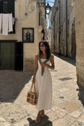 The Little Raffia Bag That Makes A Plain Dress Look Intentional