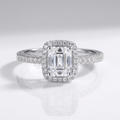 EMERALD CUT ZIRCONIA SILVER HALO RING