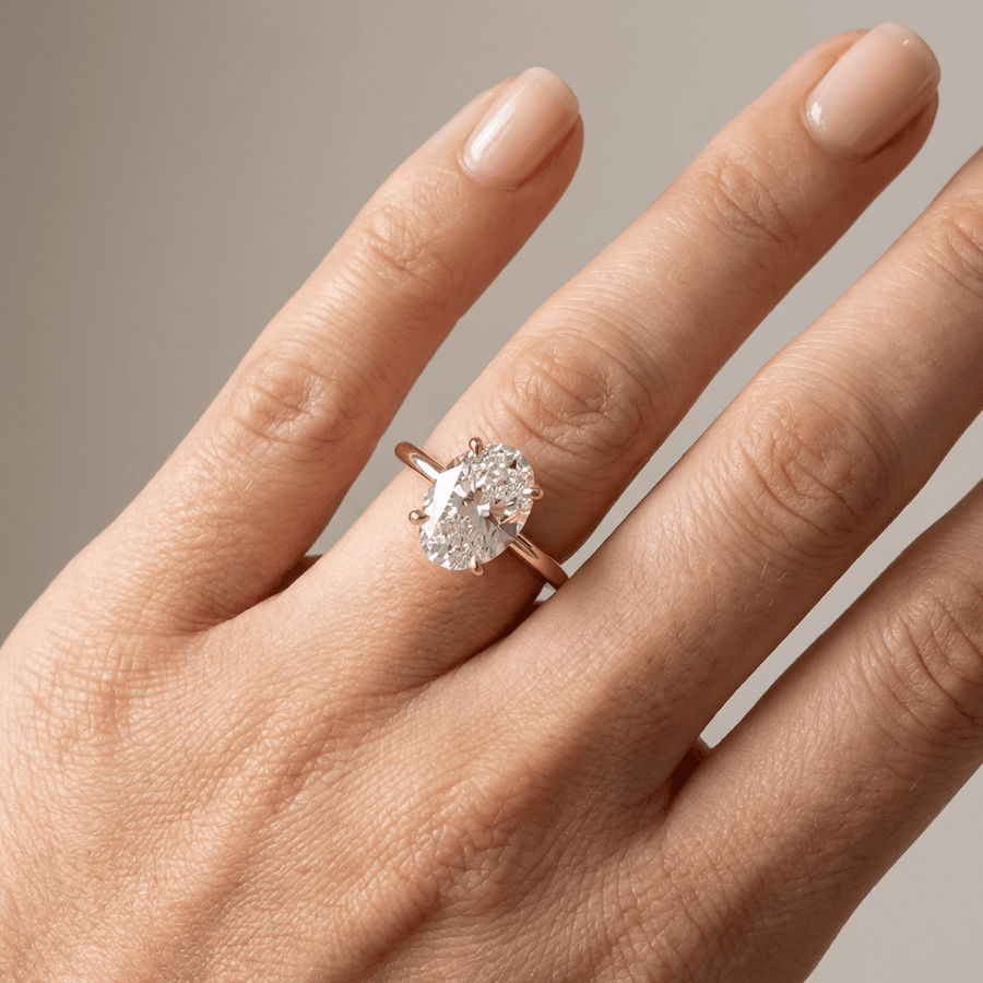 GOLD OVAL DIAMOND SOLITAIRE RING